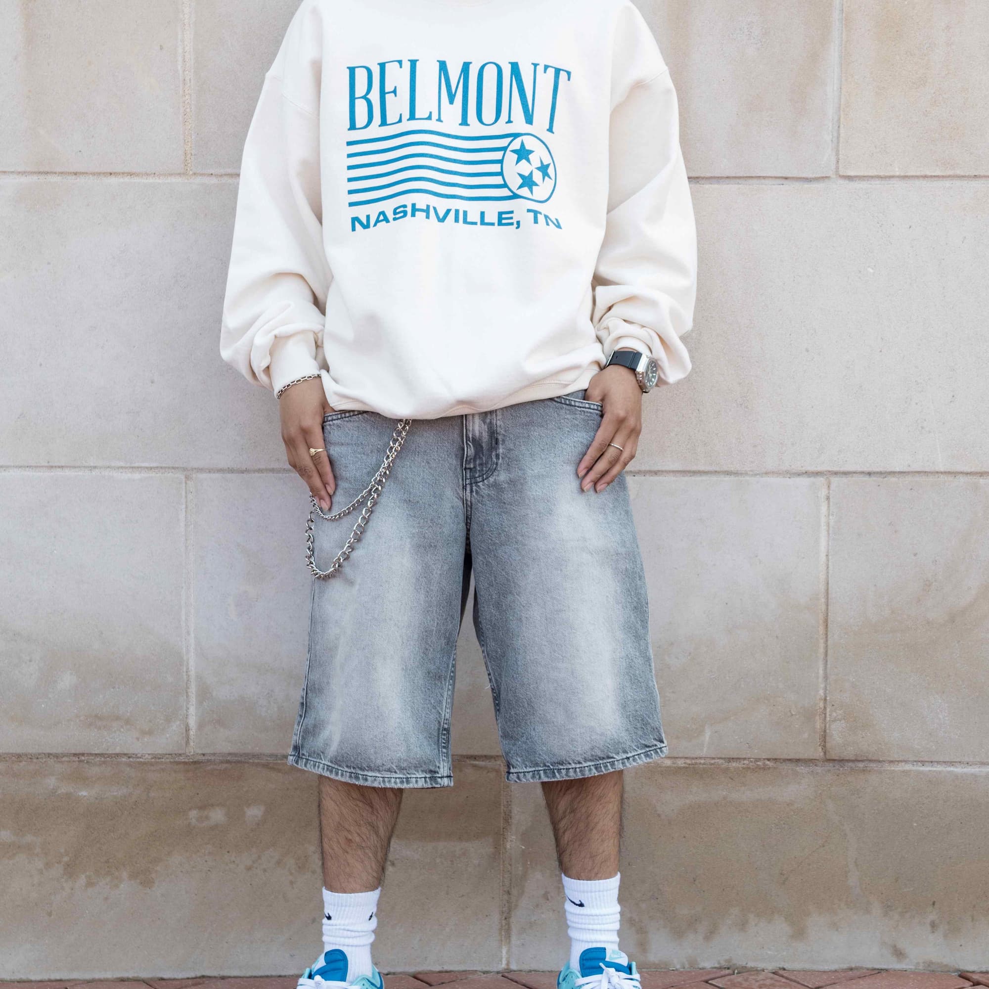 Person wearing baggy shorts and a Belmont Nashville collaboration sweatshirt. Click to view Instagram post
