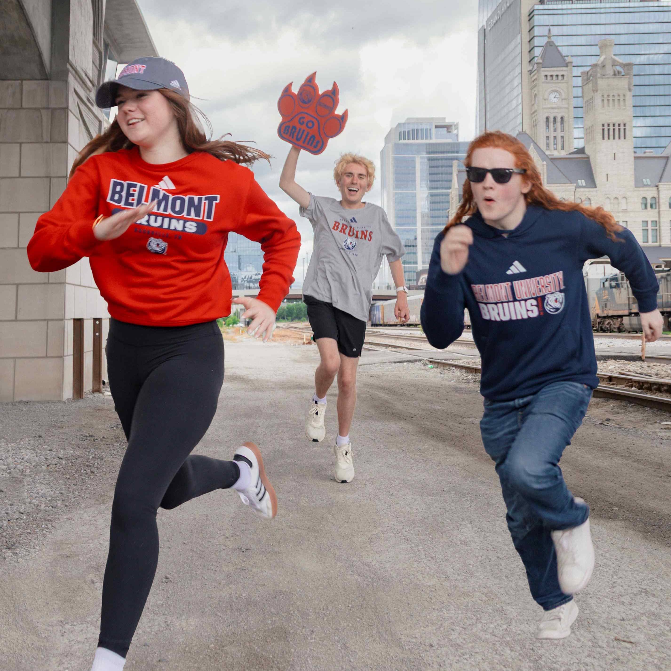 3 people wearing new BruinShop adidas gear and running down a path. Click to view Instagram post